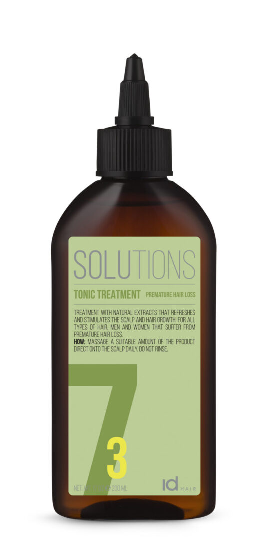 A glass bottle of tonic treatment solutions